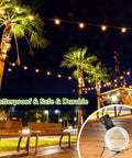100Ft Solar String Lights With 52 LED Globe Bulbs, Warm 2700K Glow, Shatterproof Outdoor Hanging Lights on palm trees