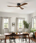 Neojoyoenix 52" Flush Mount Solid Wood Blades Ceiling Fan with Lights Remote Control,Quiet DC Motor, 6 Speed,Reversible for Patio Living Room, Bedroom, Office,Indoor.(Matte Black) in a dining area.