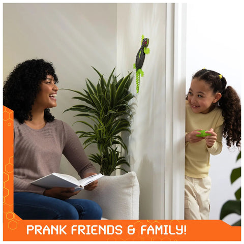 Child using remote to control Wall Crawling Gecko Robot With Remote Control Realistic Creepy Crawly Action That Climbs Walls Rechargeable Toy For Kids Ages Four And Up Prank Ready Indoor Climber A Fun Interactive Toy For Boys And Girls on wall