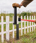 Person using Heavy Duty Fence Post Repair Kit And Quick Fix Stabilizer Bracket to install support next to white fence.