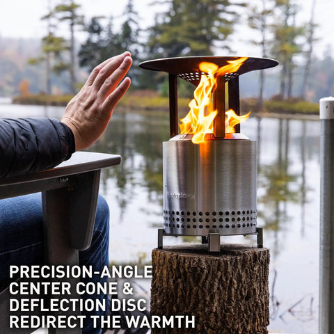 Mesa XL Heat Deflector With 3 Detachable Legs For Fire Pit captures warmth outdoors, stainless steel setup by the lake.