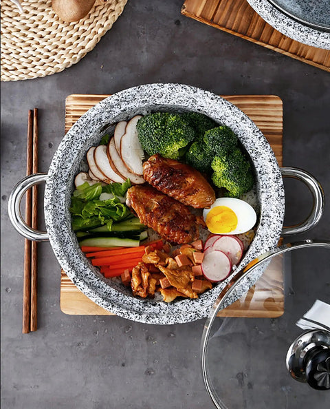 Top view of induction base granite stone bowl with glass lid and wood base heavy duty thick stone pot for Bibimbap and soups.
