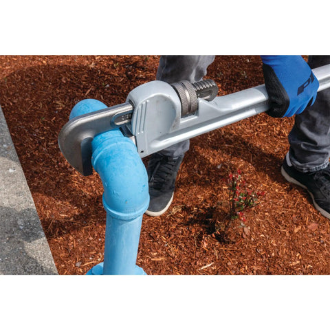 Worker using Aluminum Heavy-Duty Adjustable 36-Inch Straight Pipe Wrench With Precision Milled Jaws For Superior Grip And Durability on a blue pipe