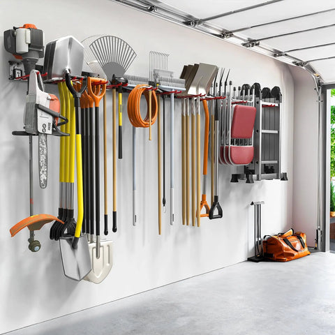 Wall Mount Garden Tool Organizer And Garage Space Saver Storage Rack For Shovels Rakes Brooms Ladders And Folding Chairs Keep Your Space Clutter Free With Keyhole Shelving Compatibility And Easy Hanging Hooks installed on a garage wall with tools and equipment hanging.