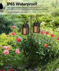 Lit LED Atmosphere Speaker 2 Pack Waterproof Outdoor Bluetooth Speaker With Torch Light and LED Lantern in garden setting