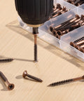 Job Site Ready Wood Screw Assortment Kit, 152 Pieces Bronze Galvanized Flat Head Phillips Drives with drill and screws on wood.