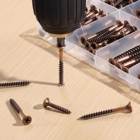 Job Site Ready Wood Screw Assortment Kit, 152 Pieces Bronze Galvanized Flat Head Phillips Drives with drill and screws on wood.