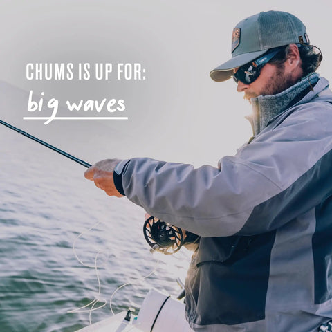 Person fishing with Travel Hat Clip With Adjustable Cap Retainer For Hiking Fishing Boating And Outdoor Adventures Lightweight 9 Inch Braided Cord Keeps Hats Secure No Fuss On Baseball Caps And Snapbacks Without Slipping Or Dropping.