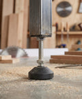 Close-up of 6 pack adjustable furniture leveling feet with M10x50mm thread and rubber base on workshop table