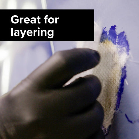 Gloved hand using Fiberglass Cloth Repair Kit 8 Sq Ft 46.5 By 25 Inches Heavy Duty Waterproof Reinforcement on blue surface.
