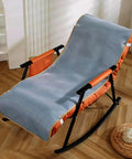 Premium Adjustable Elastic Strap Holders For Recliner Sofa Couch And Loveseat Slipcovers Keep Your Cushion Covers Locked Down Tight No More Slipping With Super Grippy Black Bands Hassle Free Quick Setup on a rocking lounge chair.