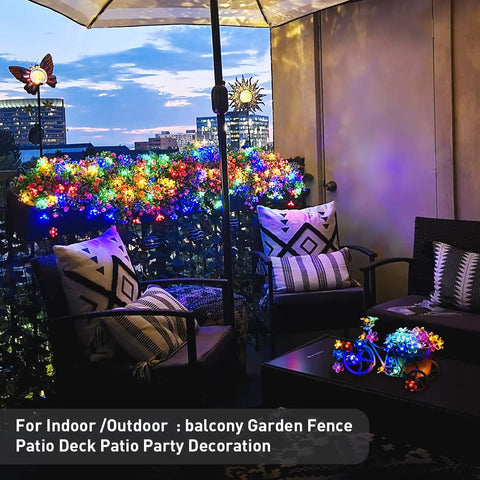 Outdoor Solar Cherry Blossom String Lights 2 Pack, 30.6 Ft Each, 50 LED Multicolor Flower Lights decorating a patio with chairs