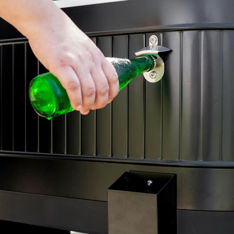 Close-up of hand opening a bottle using the opener on the 120-Qt Rolling Ice Chest Cooler Cart with Wheels, black.