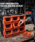 Person using Modular Garage Storage Tower With 9 Removable Bins, Wall Mount Organizer, Black And Orange Polypropylene Cabinet in workshop