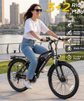 Woman riding Powerful 1000W Peak Electric Bike For Adults with 48V Battery and 22 MPH Top Speed along city street.
