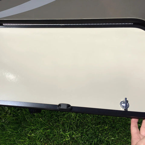 Magnetic RV Door Holder Set White Five Pairs For Secure Trailer Door Closure with hand holding exterior door on grass