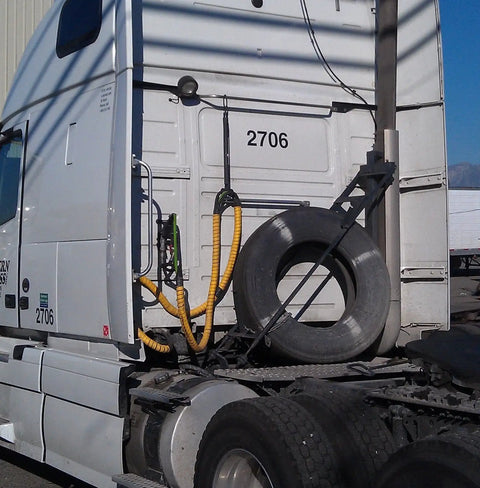 Truck with Safe-Spiral Pre-Cut Spiral Wrap Hose and Cable Protector In Yellow HD-PE, 1.25 In OD By 20 Ft Pre-Cut Length visible on trailer.