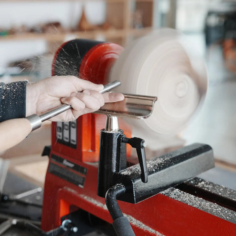 Heavy Duty 1 Inch Diameter Woodturning Lathe Tool Rest Set with steel bar positioned for shaping, showcasing woodturning in action.