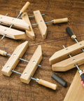 12 Inch Wooden Handscrew Clamp Set With Angled Jaws For A Grip Like A Champ On Multiple Surfaces DIY Ready Heavy Duty Wood Clamps For Precise Joinery And Woodworking Vises, shown on a wooden table.