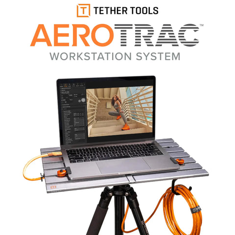 AeroTrac Foldable Laptop Tray for Tripod Mounting with laptop, shown mounted on tripod with cables, workstation for video production.