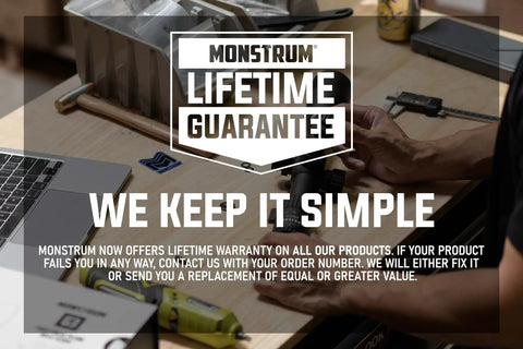 Monstrum Lifetime Guarantee displayed on a workshop table with tools, featuring Picatinny and Weaver Rail Mount for Marlin rifles.