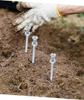 Heavy Duty Lawn Aerator Shoes With Metal Spikes, 7 Cm Deep Penetration, person wearing glove handling soil with spikes inserted