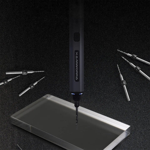 Electric drill with PCB Micro Drill Bit Set 0.5mm To 2.3mm Tungsten Carbide Jewelry Drill Bits around, on dark background.
