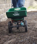 Edge Guard Mini Broadcast Spreader With Calibrated Settings And Wheels, Ideal For Lawns Up To 5,000 Sq Ft spreading on dirt path