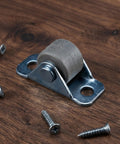 Eight Piece Low Profile Rigid Rubber Caster Wheels Non Swivel Fixed Plate Casters With Silent Rolling And Floor Saving Design For Heavy Furniture Bedroom Appliances And Small Trolleys No Sweat Moving For Your Furniture Everyday on a wooden surface with screws.