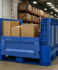 Heavy Duty Collapsible Bulk Box 48x40x33 Inch Plastic Storage Tote filled with cardboard boxes in a warehouse.