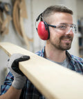 Man wearing Wood Carving Gloves No Nonsense Hand Protection Heavy Duty Level 5 Cut Resistant Work Gloves For Woodworking And Whittling Flexible Breathable Touchscreen Compatible Machine Washable while holding a plank