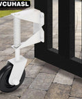 Rugged Spring Loaded Gate Caster Wheel Built Like A Tank Wood Fence Roller With 360 Swivel 4.5 Inch mounted on a gravel path.