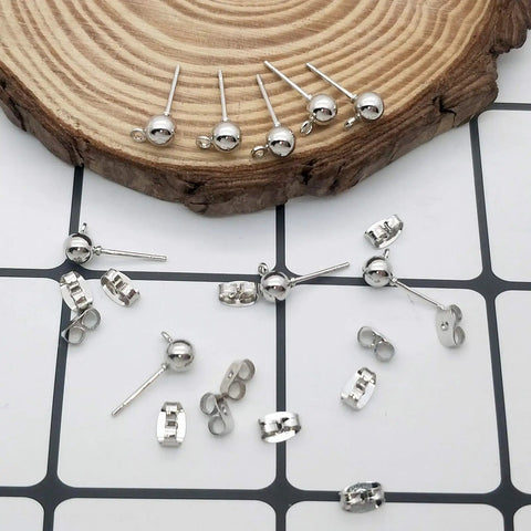 100 Pcs White K Ball Earring Studs With Loop Backs Hypoallergenic Posts For Jewelry Making Craft Projects And DIY Earring Supplies Ideal For Custom Studs Hoops Bead Jewelry And Creative Jewelry. silver ball stud earrings with loop backs on wood display