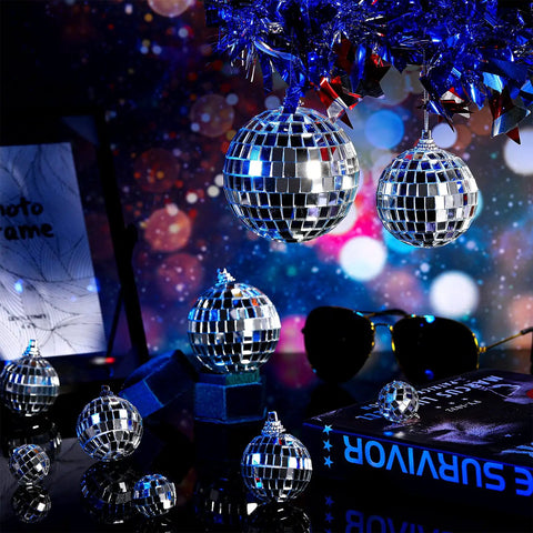Various sizes of 30 Pcs Mini Disco Ball Ornaments Hanging Mirror Balls For Party Decor Wedding on dark reflective surface