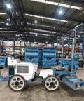 Automated Concrete Screed Machine For No Fuss Warehouse Flooring And Paving Jobs, Customizable Configurations, Continuous Elevation Scan, Heavy Duty Tool For Farming, Construction, And Land Management, High Quality Build And Durable, blue wheeled unit in warehouse