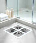 Hair Drain Stickers 100Pcs Disposable Self Adhesive in a shower setting with toiletries and towels.
