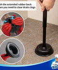 Heavy Duty Bathroom Plunger Duo With Sleek Ventilated Mount showing rubber bowl and long wooden handle on floor for clearing clogs.