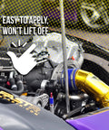 Engine bay with gold Reflect-A-Gold heat-insulation tape wrapping a hose; Design Engineering branding visible