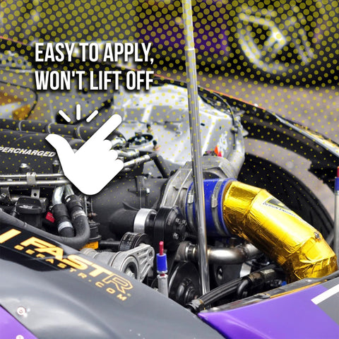 Engine bay with gold Reflect-A-Gold heat-insulation tape wrapping a hose; Design Engineering branding visible