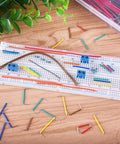 560 Piece Jumper Wire Kit With 14 Lengths Of Assorted Preformed Breadboard Wires, Male To Male 24 AWG U Shaped Jumpers on breadboard