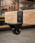 8 Piece L Shaped Plate Casters For Furniture And Luggage With Rubber Wheels, mounted on wooden surface