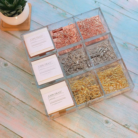 Top view of Premium Acrylic And Gold Base Note Holder And Paper Clip Organizer with paper clips on a wooden desk