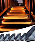 Upgrade Your Backyard With Solar Powered Deck Lights Eight Pack Led Step And Fence Lights illuminating wooden stairs at night