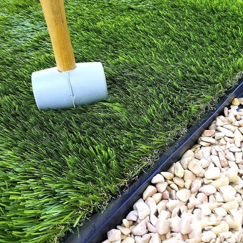 2 Inch Tall Landscape Edging Kit With 20 Ft Coil And 20 Spikes installed along lawn and stone path, weather-resistant plastic