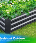 Close-up of a galvanized raised garden bed filled with leafy greens, showing its durable metal construction on grass.