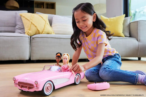 Child playing with Remote Control Corvette Toy Car From Barbie Movie With Full Function RC Open Trunk Front Seats For Two Barbie Dolls Accessories Sold Separately Epic Play Vehicle For Barbie Fans And Collectors