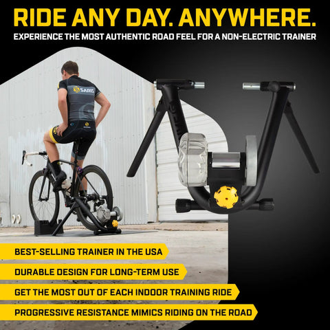 Cyclist using Fluid2 Indoor Bike Trainer For Road And Mountain Bikes With Realistic Road Feel And Progressive Fluid Resistance