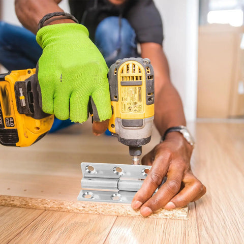 Installing detachable lift off hinges, heavy duty stainless steel, 4 pack, on wooden surface with drill, easy setup.