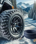 Hybrid Air Hose 1/4 Inch By 25 Feet, Lightweight Yet Tough As Nails, shown coiled near a rugged vehicle tire in snowy landscape
