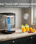 Portable Countertop Ice Maker Keeps Things Icy Fast With 26 Pounds Daily Bullet Ice And Hassle Free Self Cleaning on kitchen countertop.